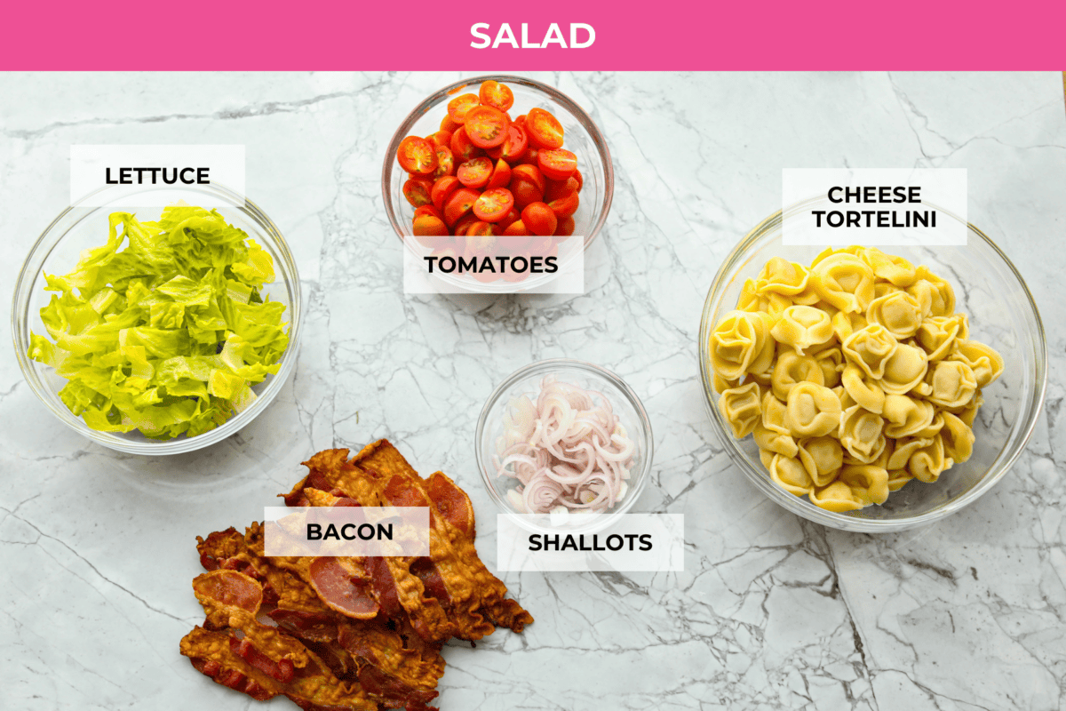 Overhead shot of labeled salad ingredients. 