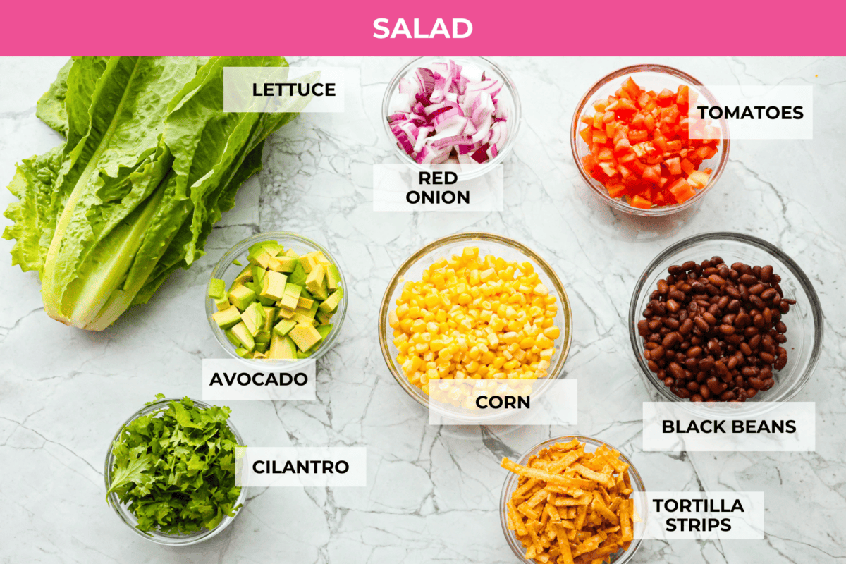 Overhead shot of labeled salad ingredients. 