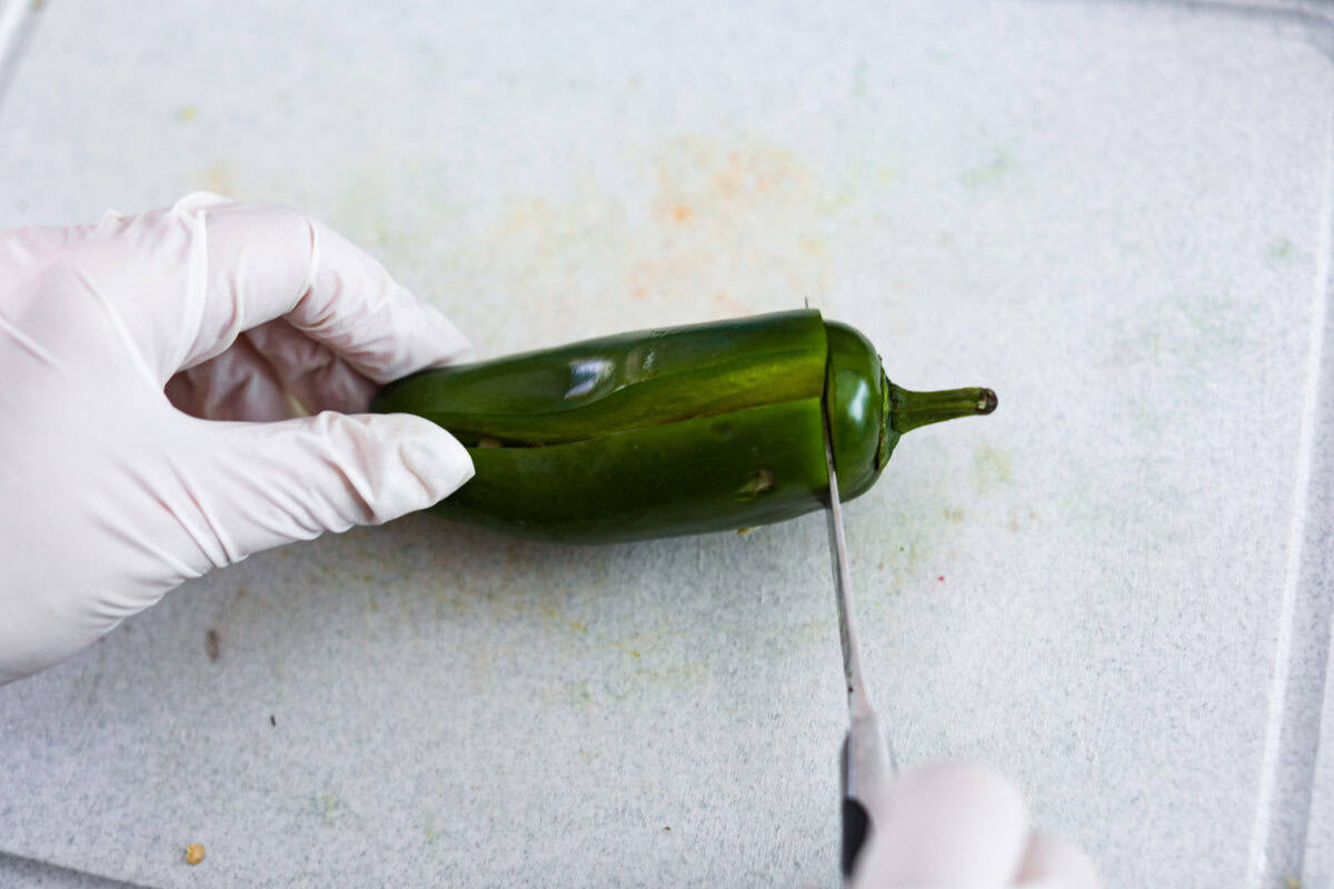 Overhead shot of how to cut jalapeños. 