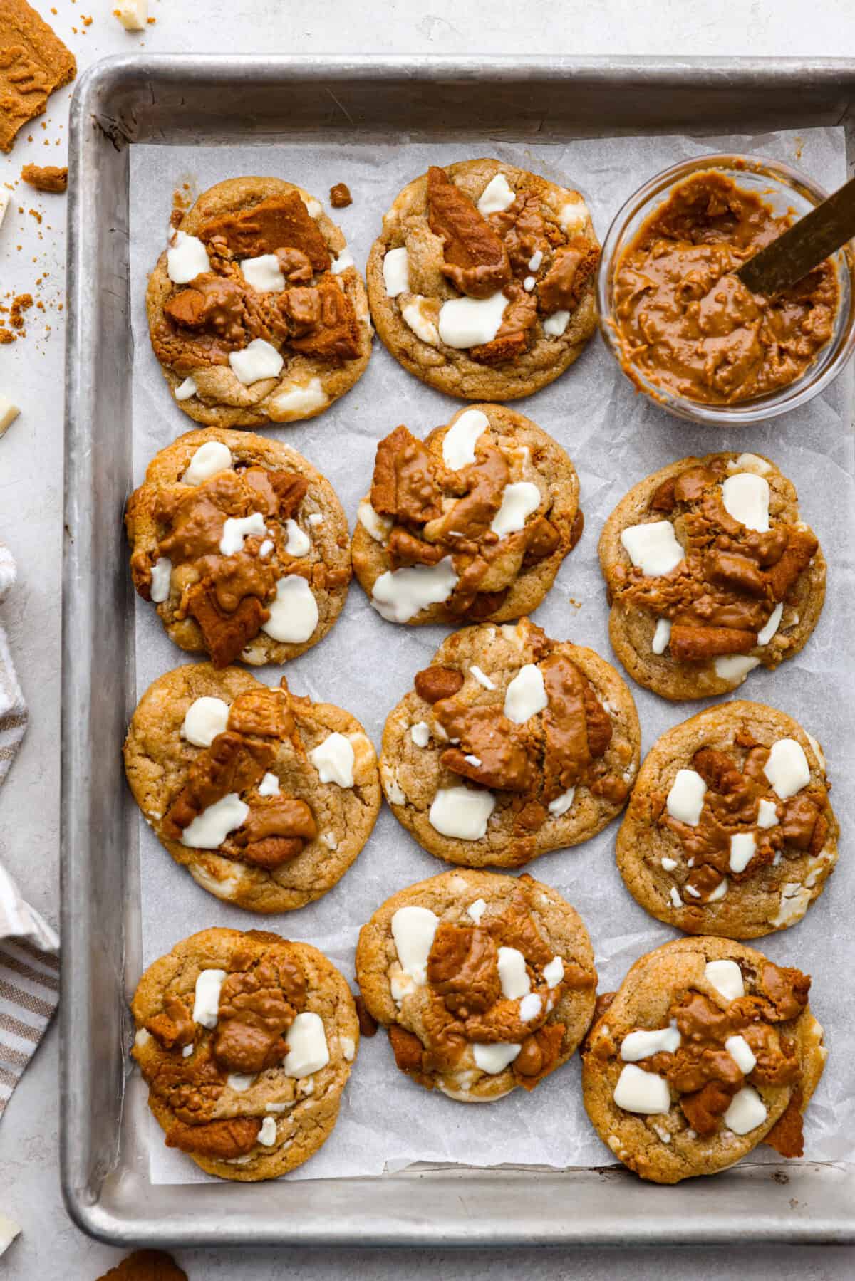 Overhead shot of baked Biscoff cookies on a cookie sheet. 