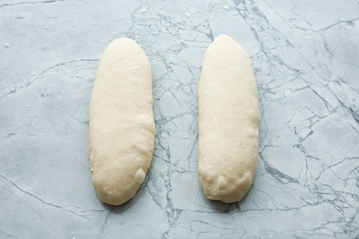 Overhead shot of two dough loafs. 