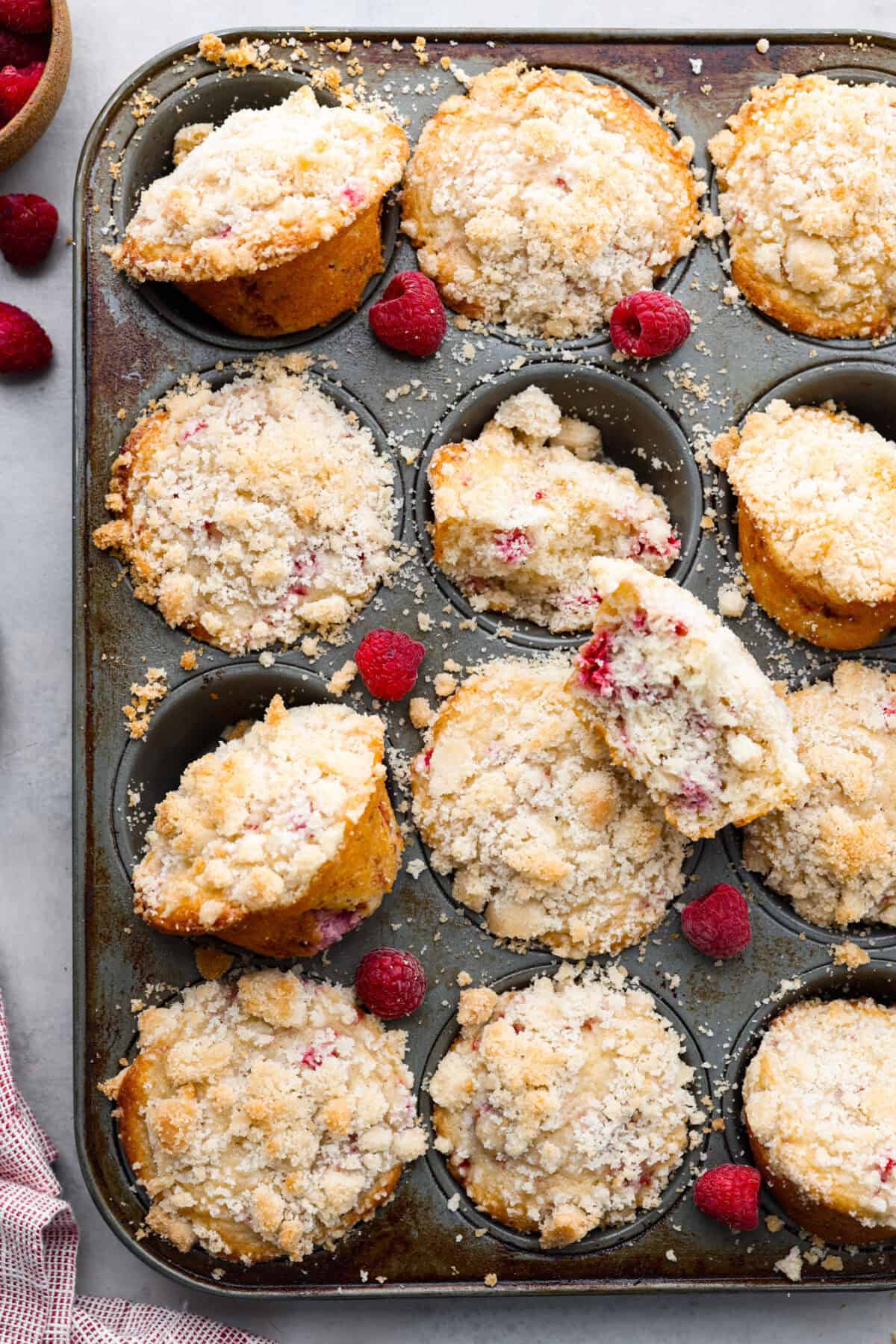 Overhead shot of baked raspberry muffins in muffin tin. 