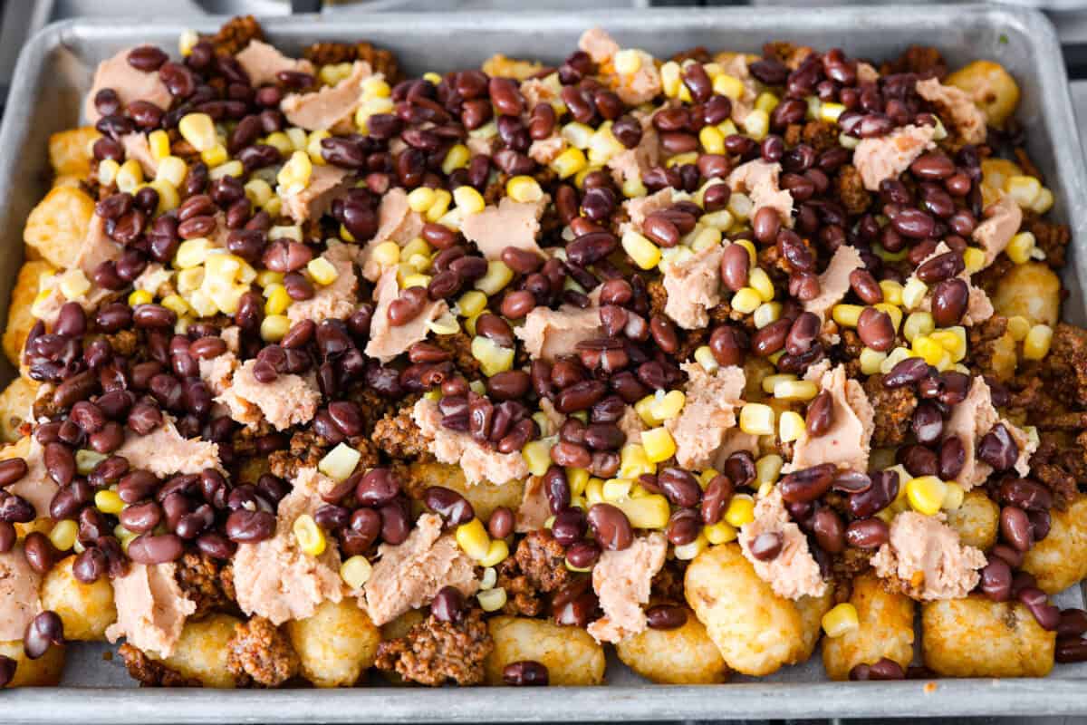 Overhead shot of prepared pan with added black beans and corn. 
