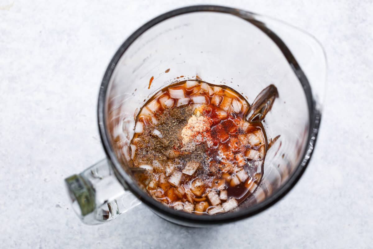 Overhead shot of ingredients dumped in a blender. 