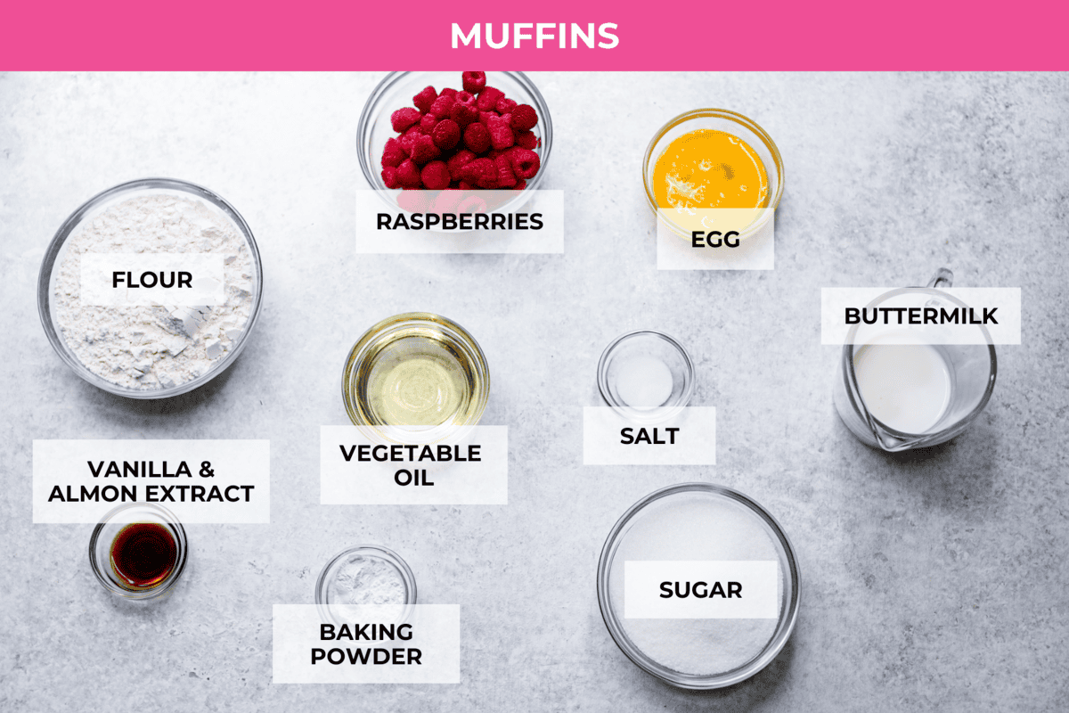 These raspberry muffins are moist and delicious, filled with plump fresh raspberries and topped with a sweet, crunchy streusel topping! They are perfect for a warm breakfast, brunch, or as an after-school or work snack. Your family will be begging for more, so don’t expect them to last long! Overhead shot of labeled muffin ingredients.