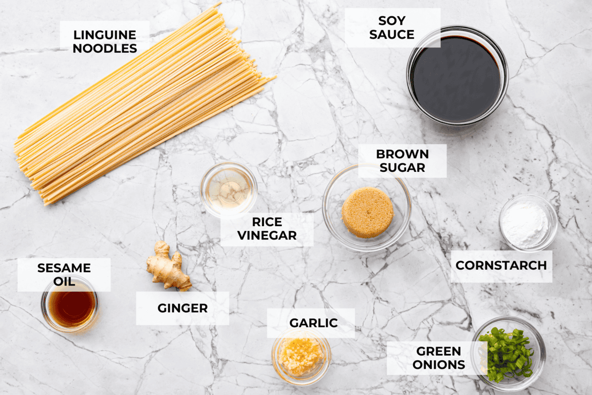 Packed with flavor, these easy Teriyaki Noodles are so much better than takeout! Throw these together in just 20 minutes with pantry staples for the perfect busy weeknight dinner. You can keep it vegetarian or serve it alongside your favorite protein. Overhead shot of labeled ingredients.
