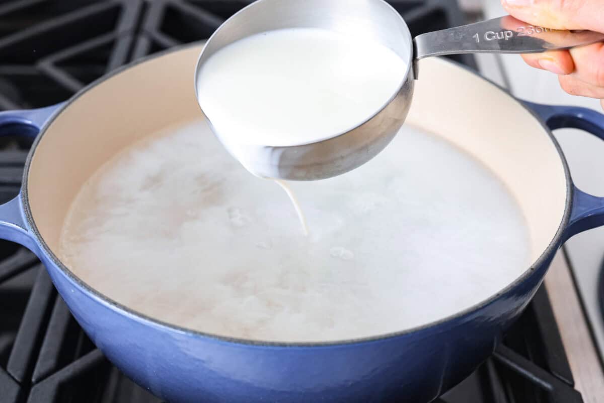 Second photo of the milk pouring in the pot.