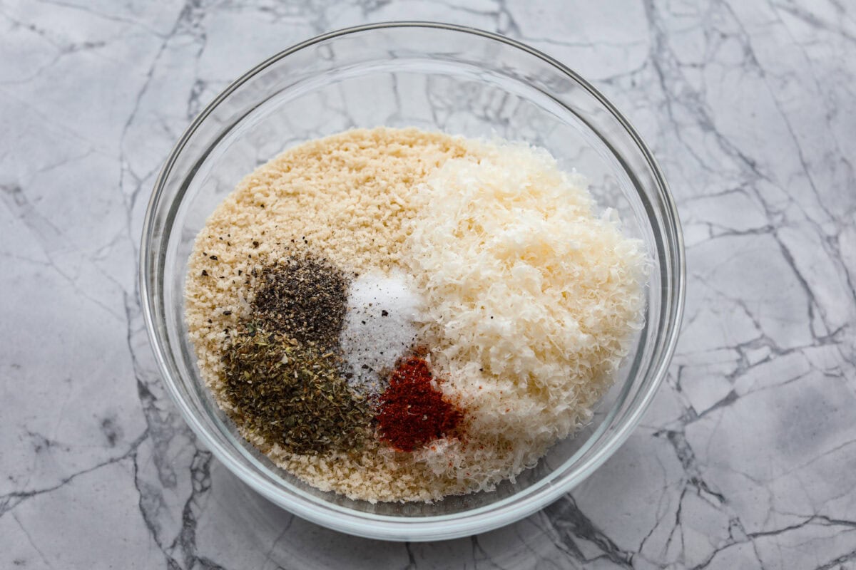 Overhead shot of breading ingredients in a glass bowl. 