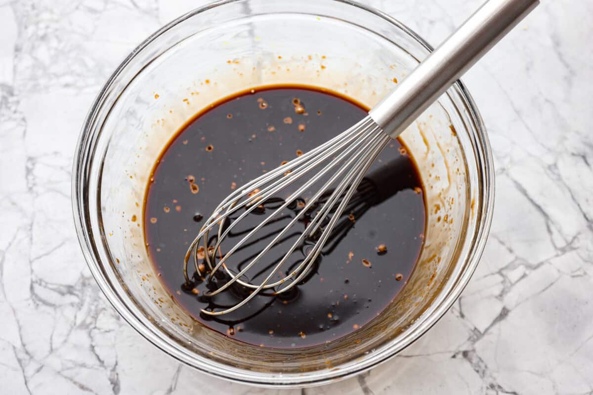 Overhead shot of teriyaki sauce ingredients whisked in a bowl. 