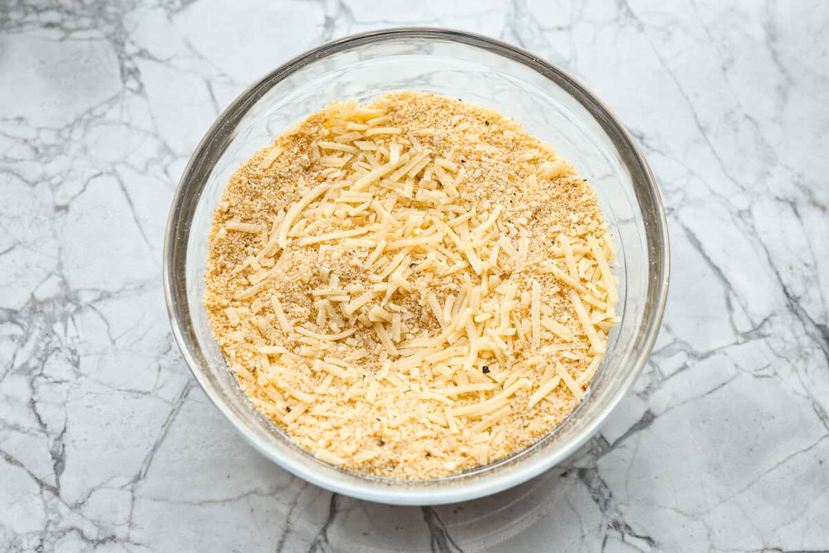 This delicious Louisiana Casserole has become an instant favorite in our house! It has all of the delicious flavors of a jambalaya in an easy-to-make casserole. Tasty andouille sausage, shrimp, veggies, rice and cajun seasoning come together for a complete meal on the table in just 40 minutes! Overhead shot of crumb topping ingredients mixed in a bowl.