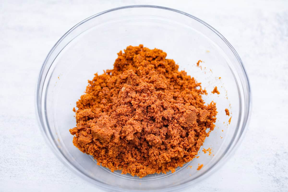 Overhead shot of crust ingredients mixed in a glass bowl. 