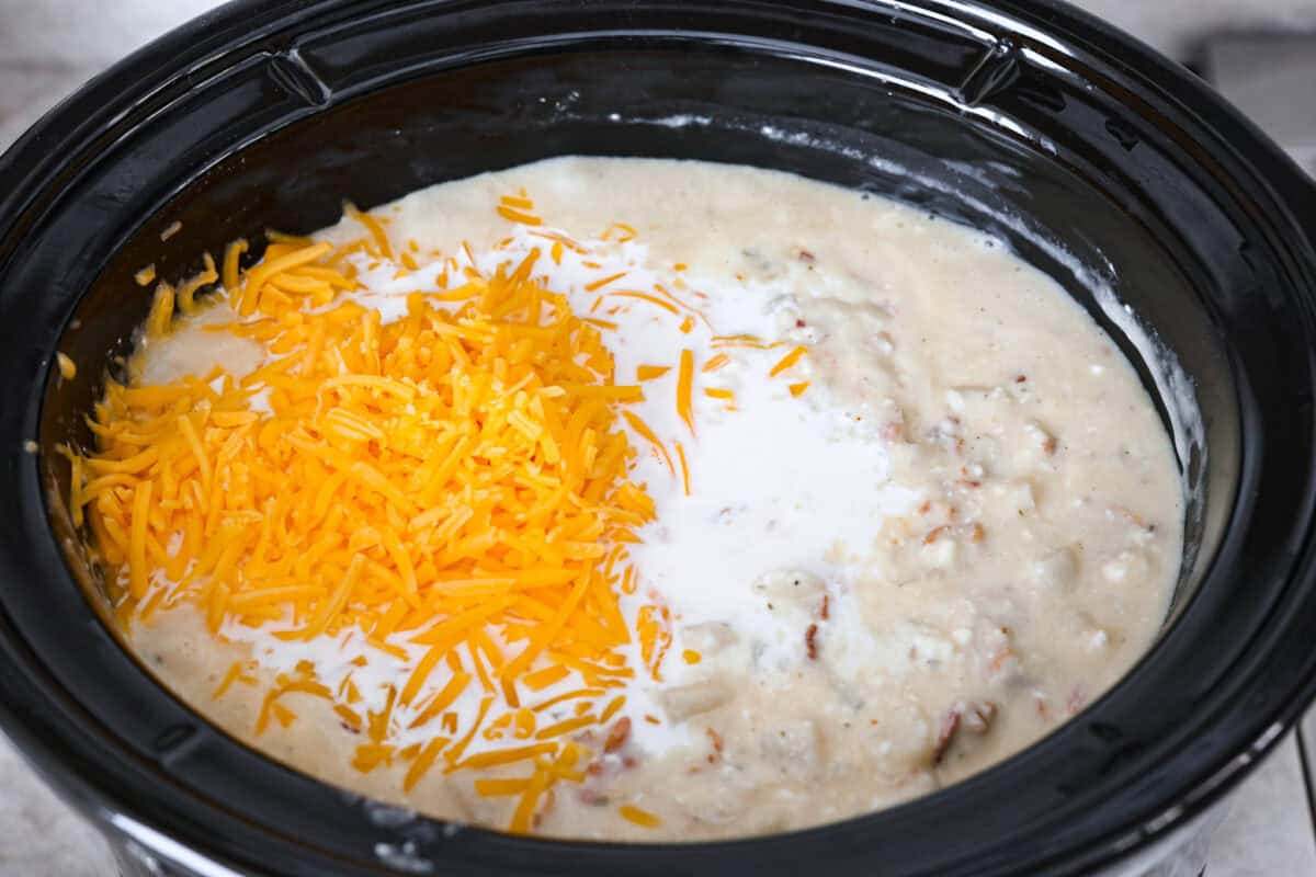 Cheese on top and half-and-half on top of mixed soup in the crock pot. 