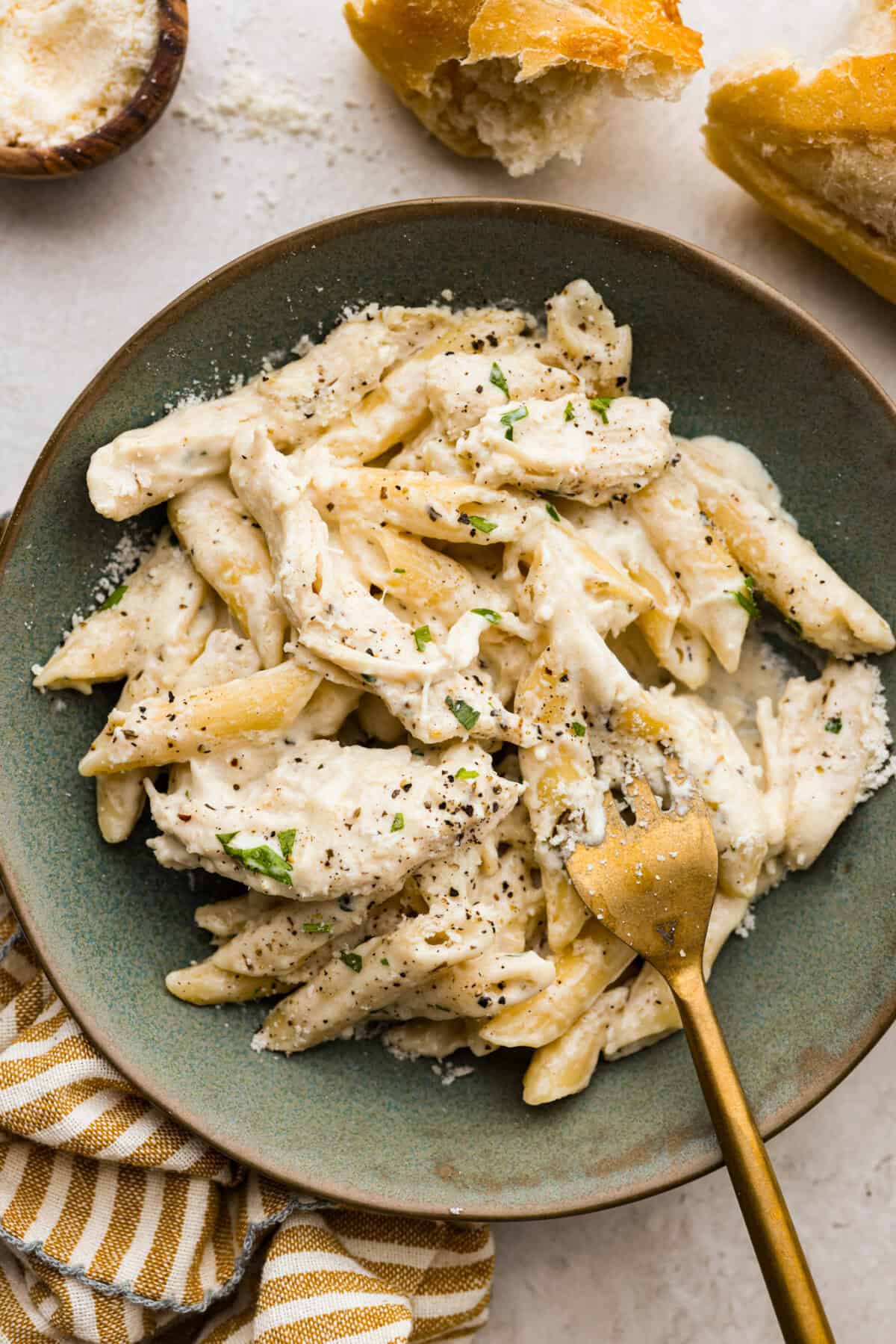 Overhead shot of plated crockpot chicken Alfredo. 