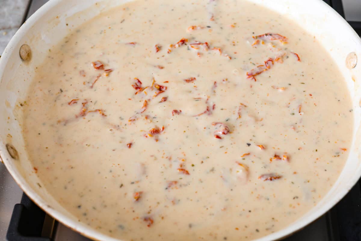 Overhead shot of sauce mixed together and simmering on the stove top.