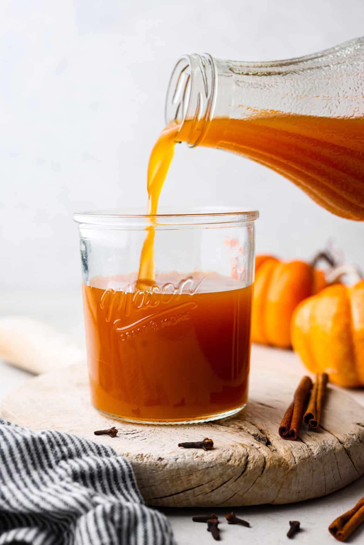 Side shot of Harry Potter pumpkin juice being poured into a glass. 