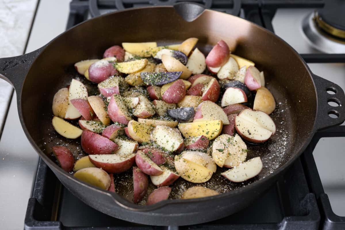 Second photo of the potatoes cooking in a skillet.