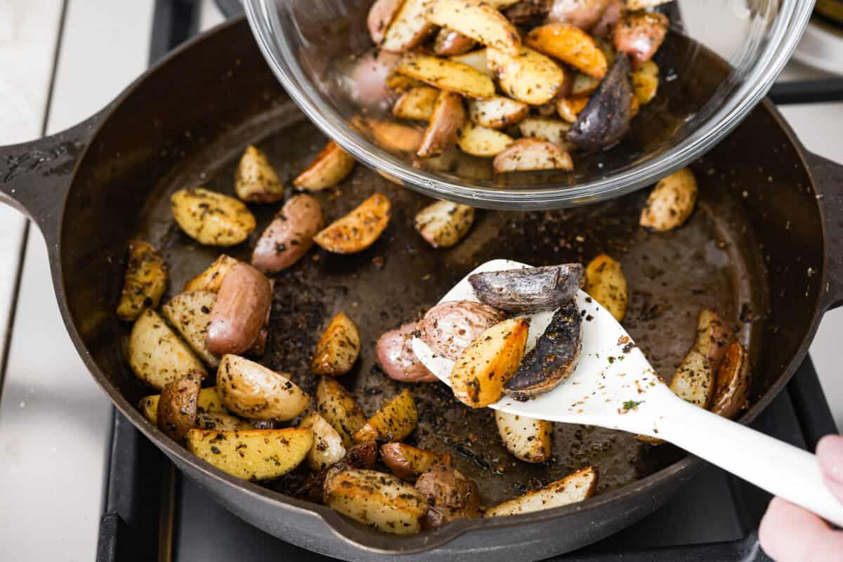 Third photo of the potatoes being removed from the skillet.