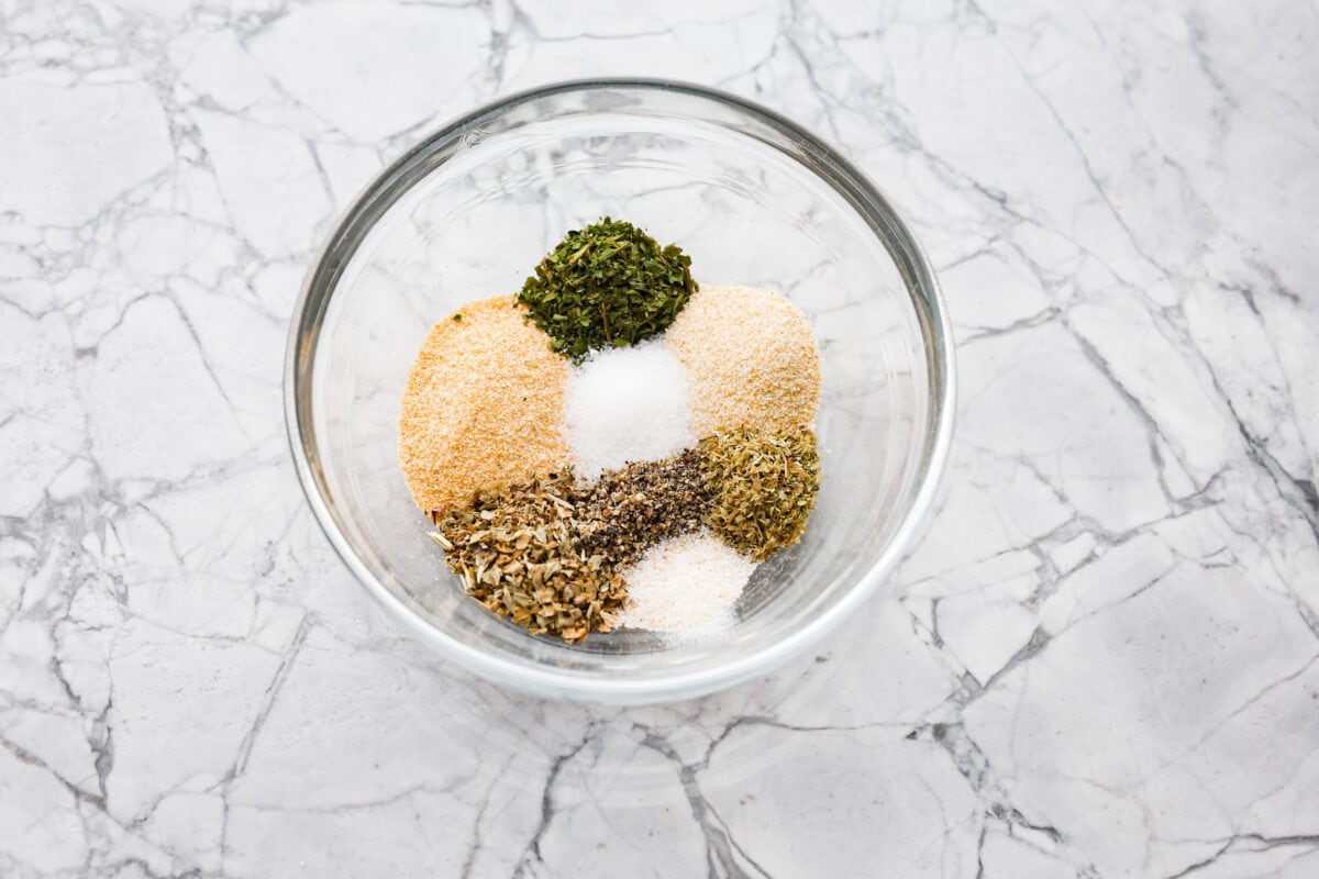 Overhead shot of the herbs and spices in a glass bowl. 