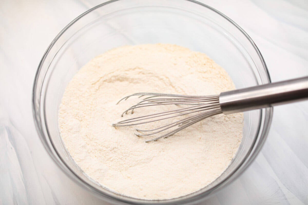 Overhead shot of the dry ingredients whisked together in a glass bowl. 