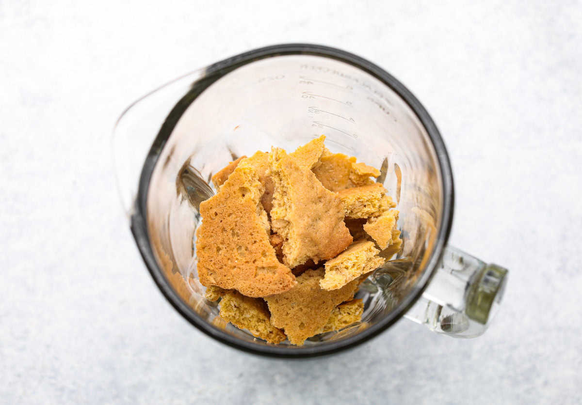 Delicious and addicting, the famous Crack Pie is what made Milk Bar bakery so popular. This copycat recipe is made with a sweet and salty filling tucked inside a crispy oat cookie crust. It’s so good you won’t be able to stop eating it! Overhead shot of oatmeal cookie chunks in a blender.