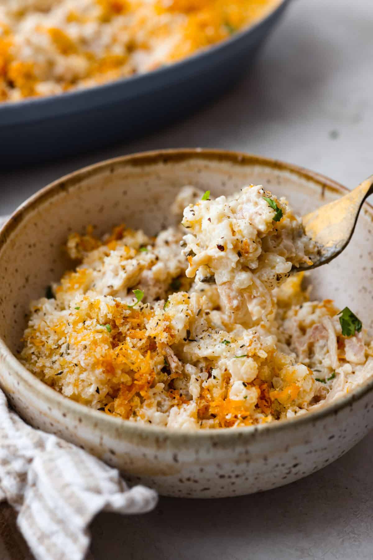 Angle shot of a bowl of angel chicken and rice casserole. 