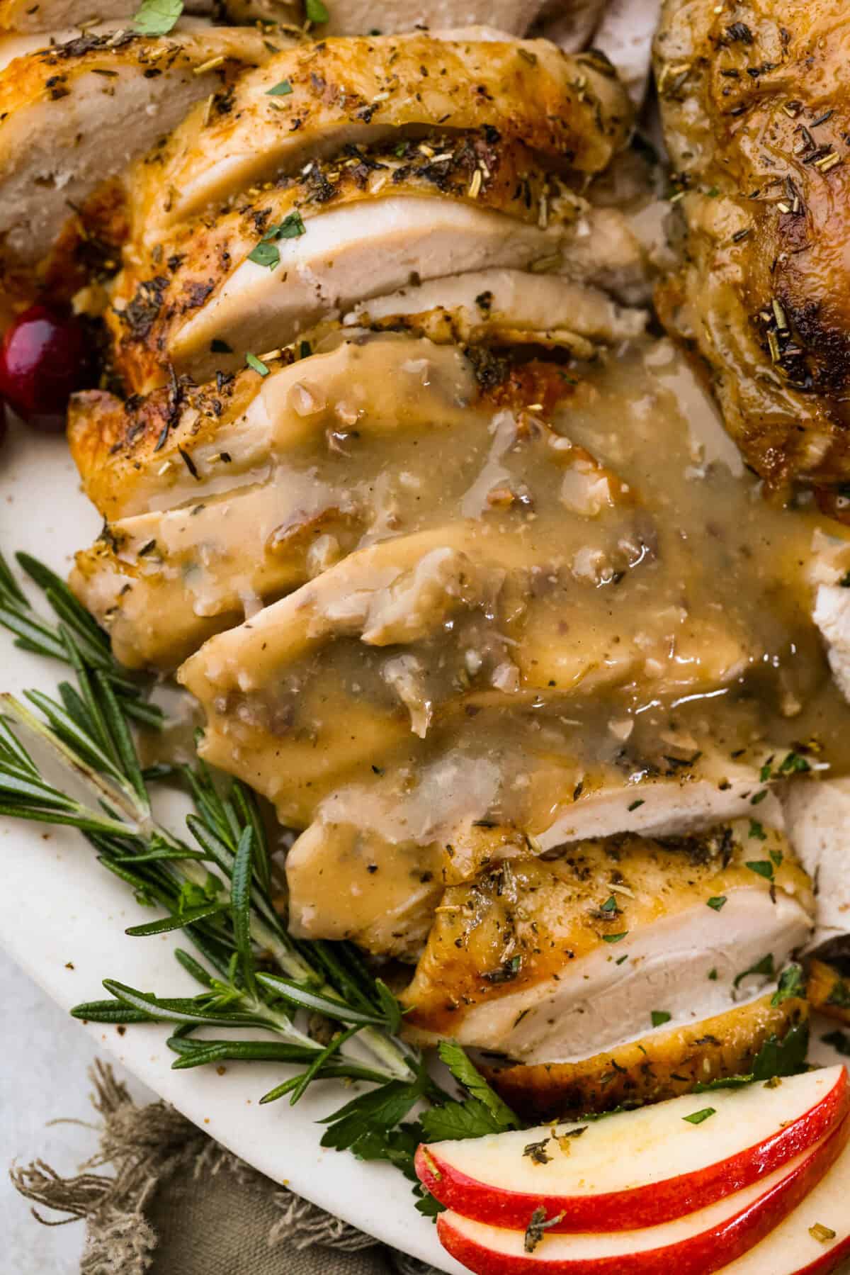 Overhead shot of plated turkey with giblet gravy poured over the top. 