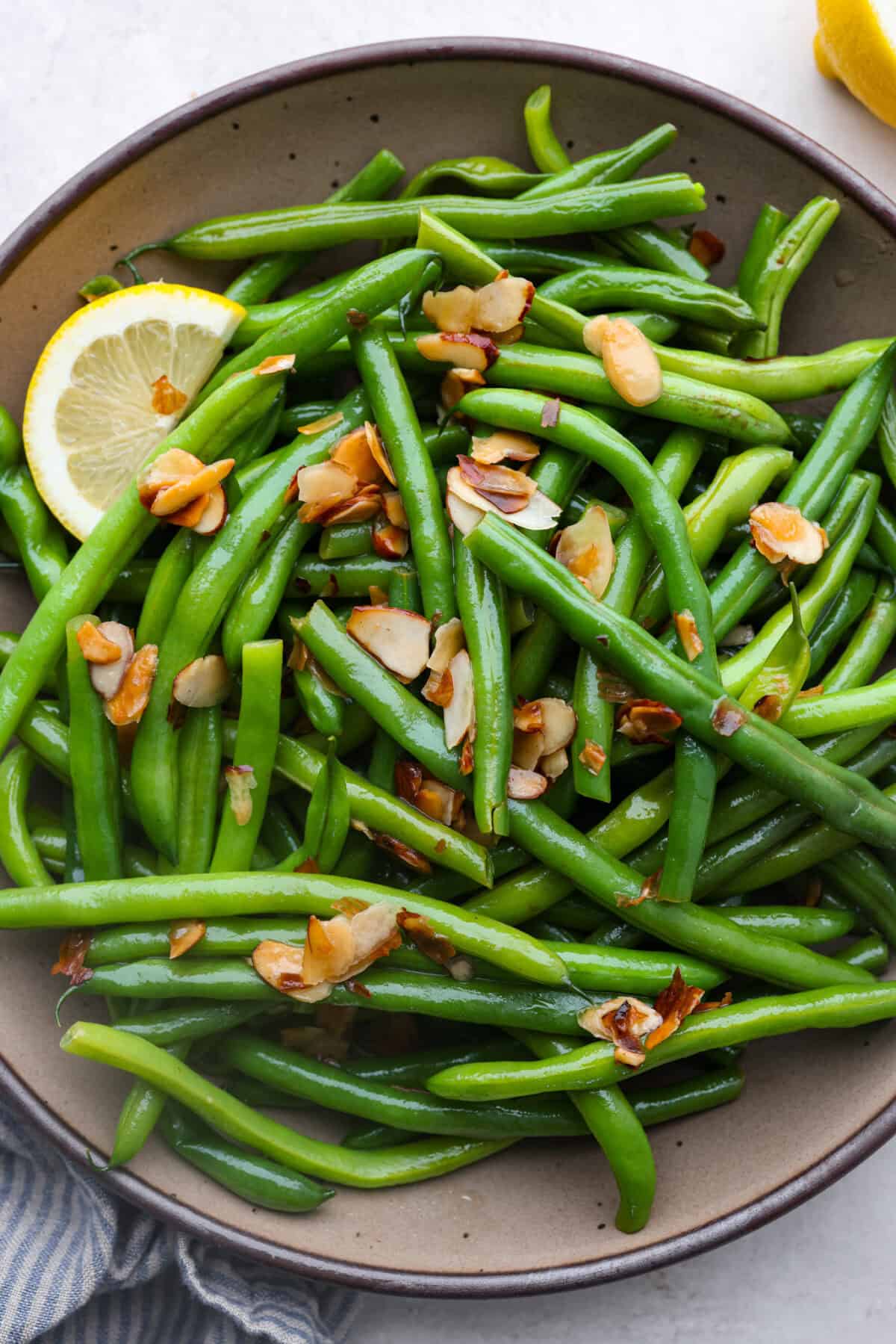 Overhead shot of green beans Almondine in a serving platter. 