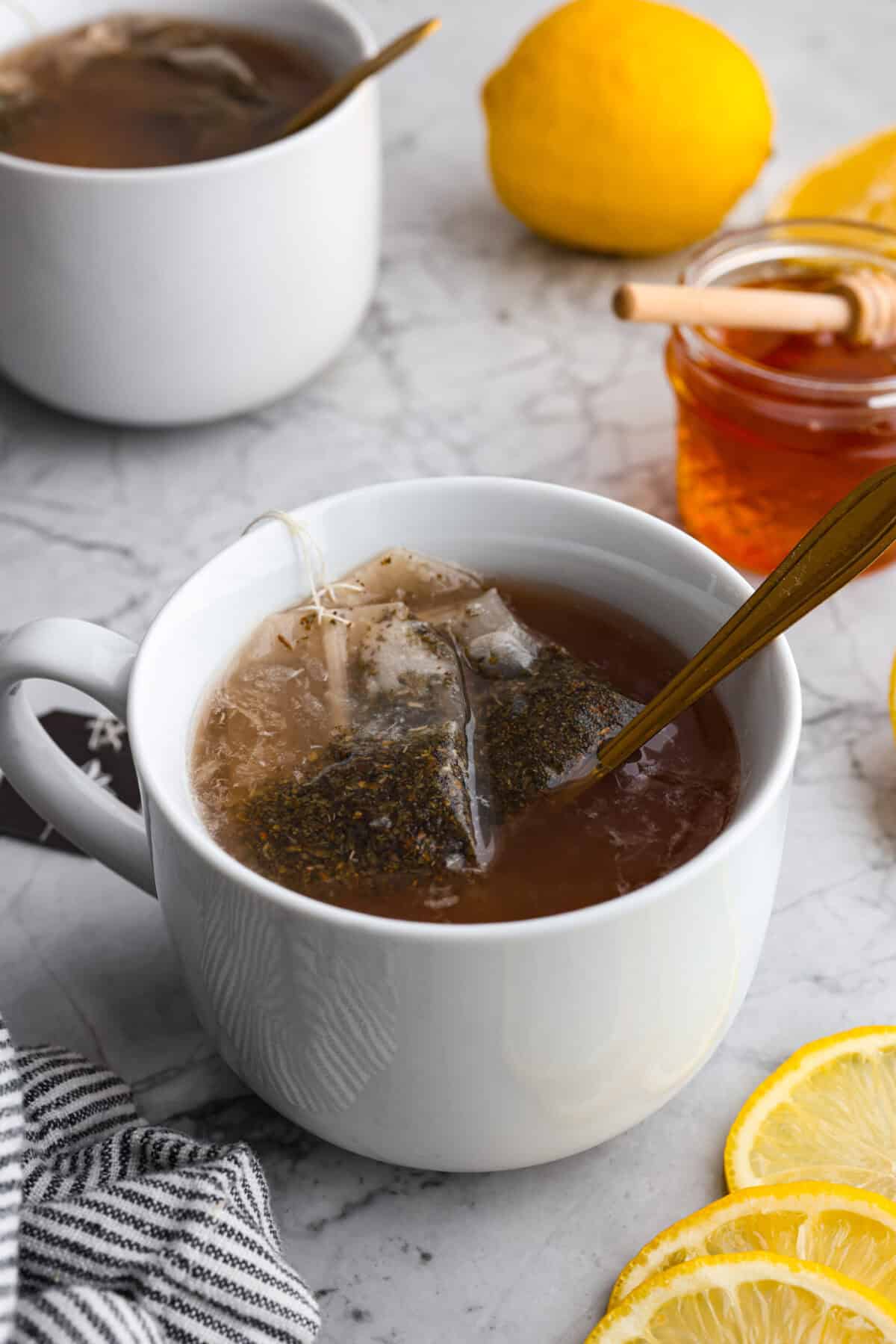 Angle shot of the copycat Starbucks medicine ball tea in a mug. 