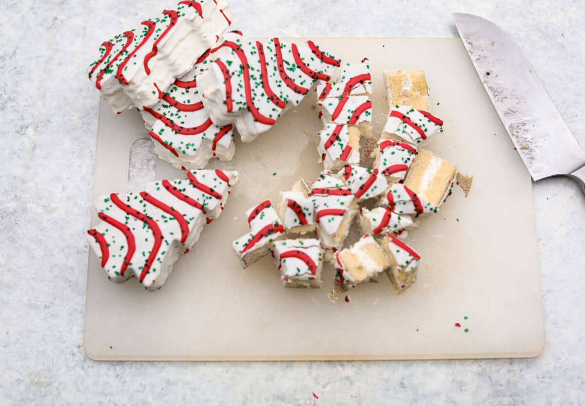 Overhead shot of cut up Christmas tree cakes. 