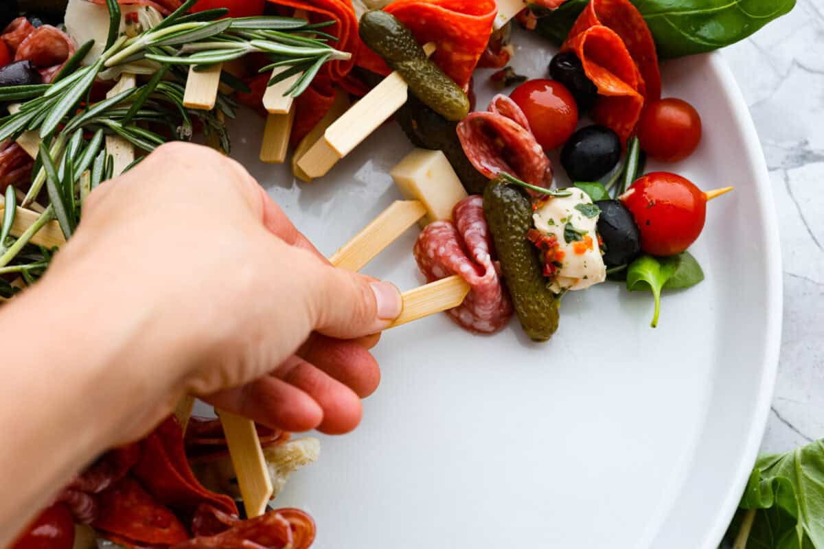 Third photo of arranging and shaping  the antipasto charcuterie wreath.