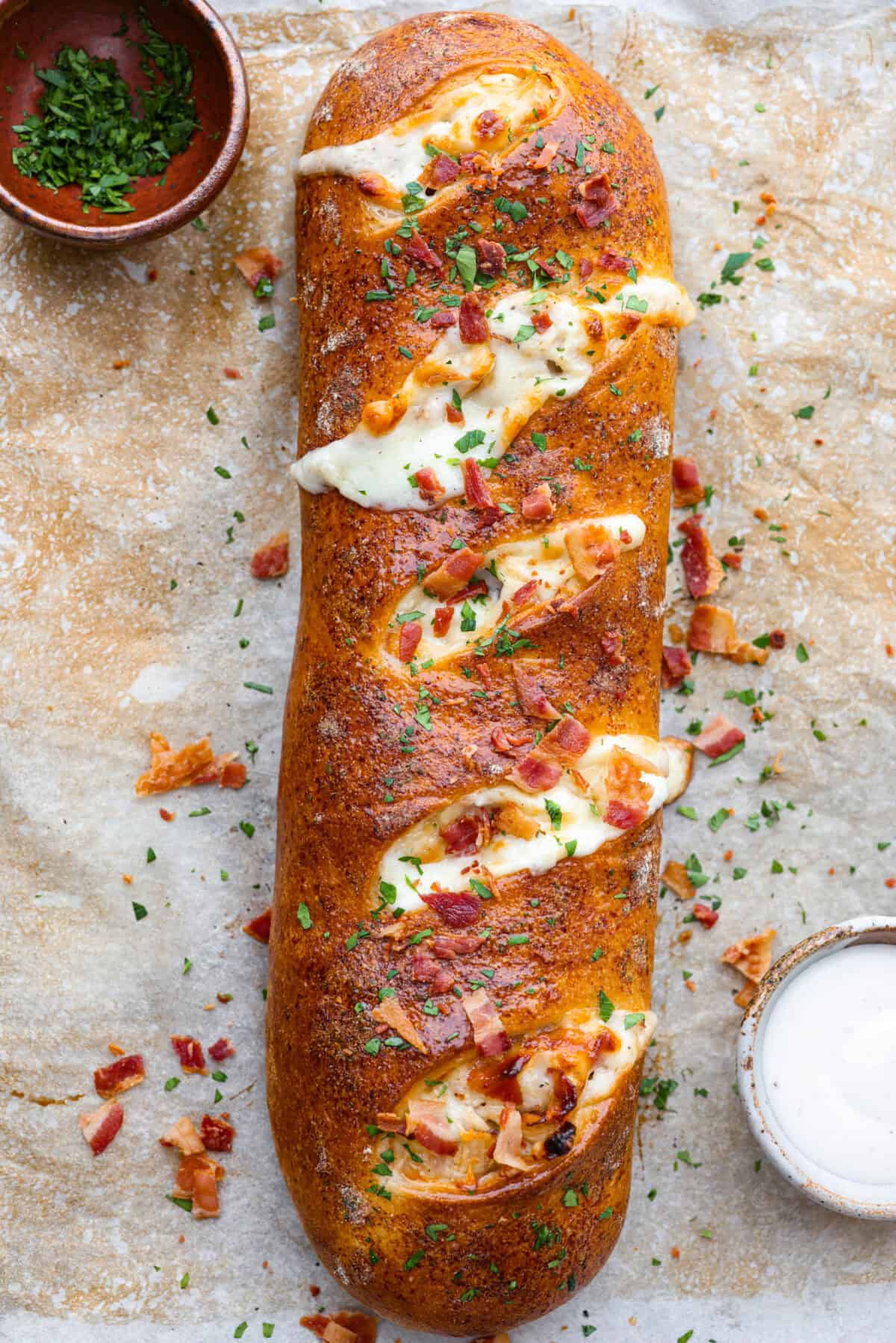 Overhead shot of baked chicken bacon ranch Stromboli. 