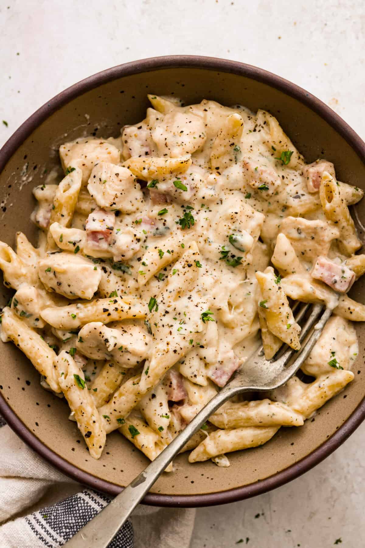 Overhead shot of plated chicken cordon bleu pasta.