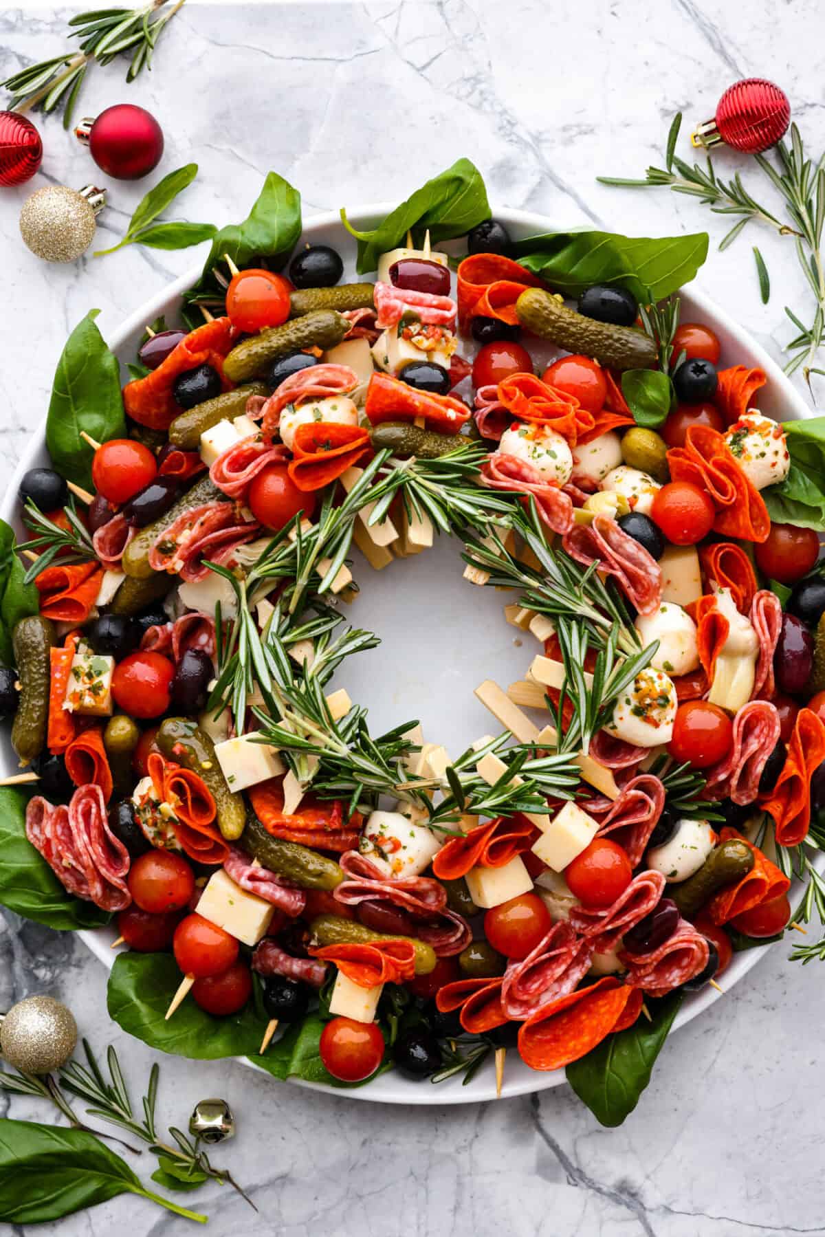 Top view of antipasto charcuterie wreath on a round platter.