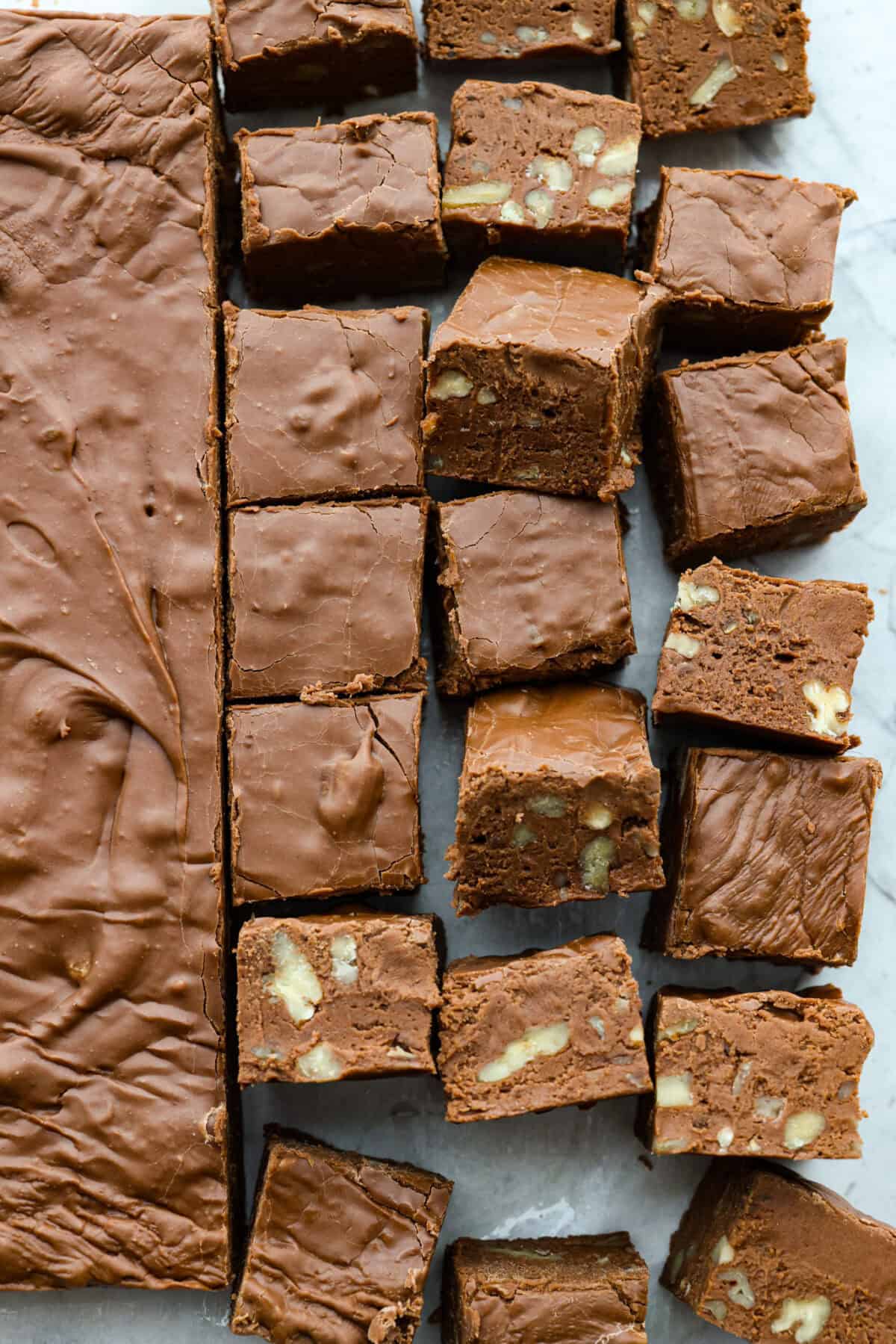 Overhead shot of the brick of fudge cut into pieces with some turned on their side. 