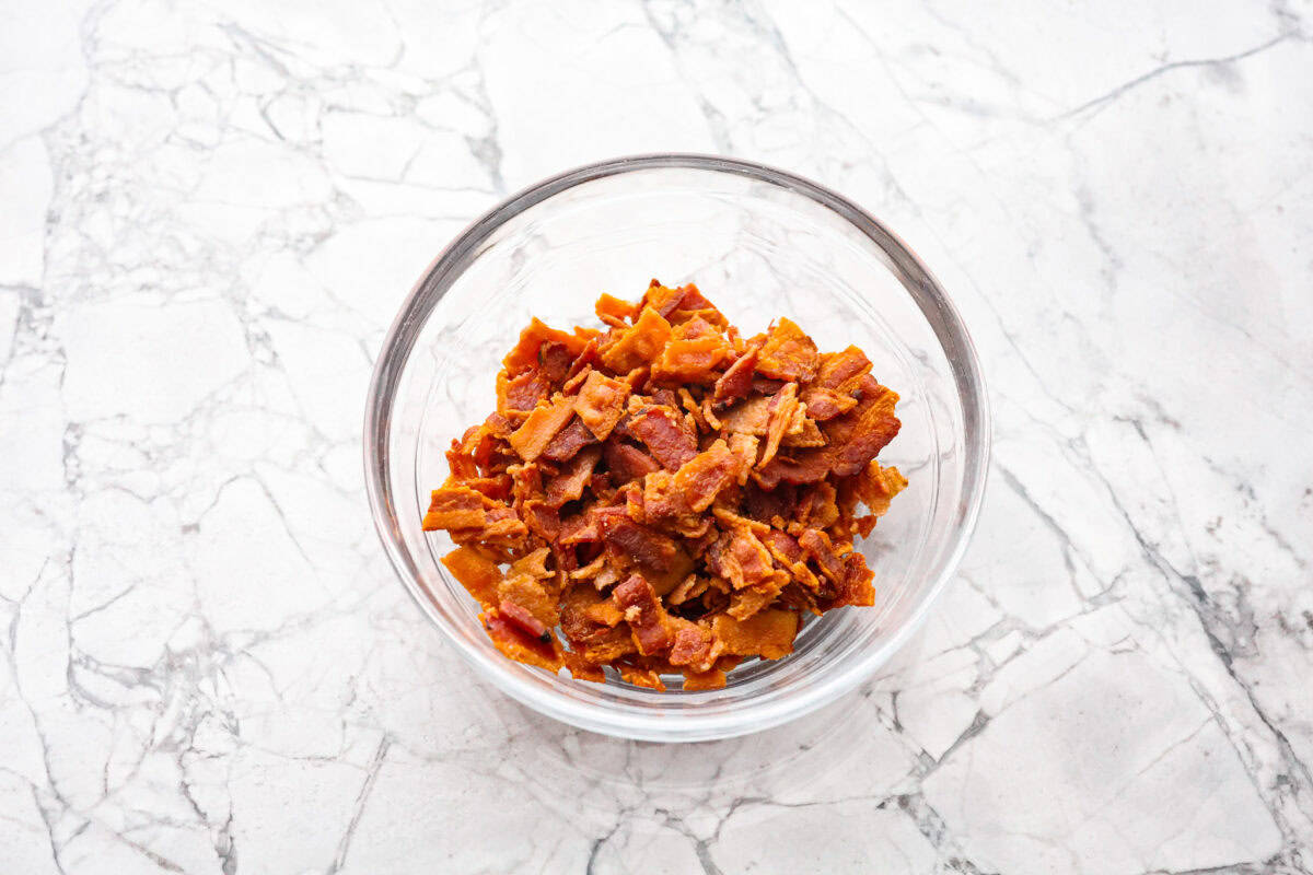 Overhead shot of a bowl of cooked bacon bits.