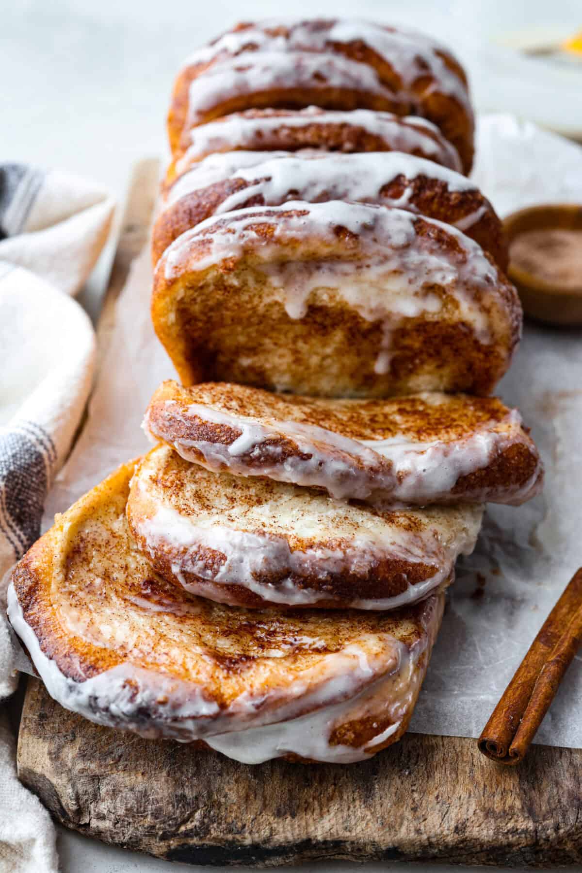 Angle shot of cinnamon pull-apart bread out of the loaf pan. 