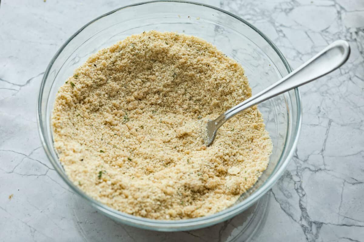 Angle shot of crumb topping ingredients mixed together in a bowl.