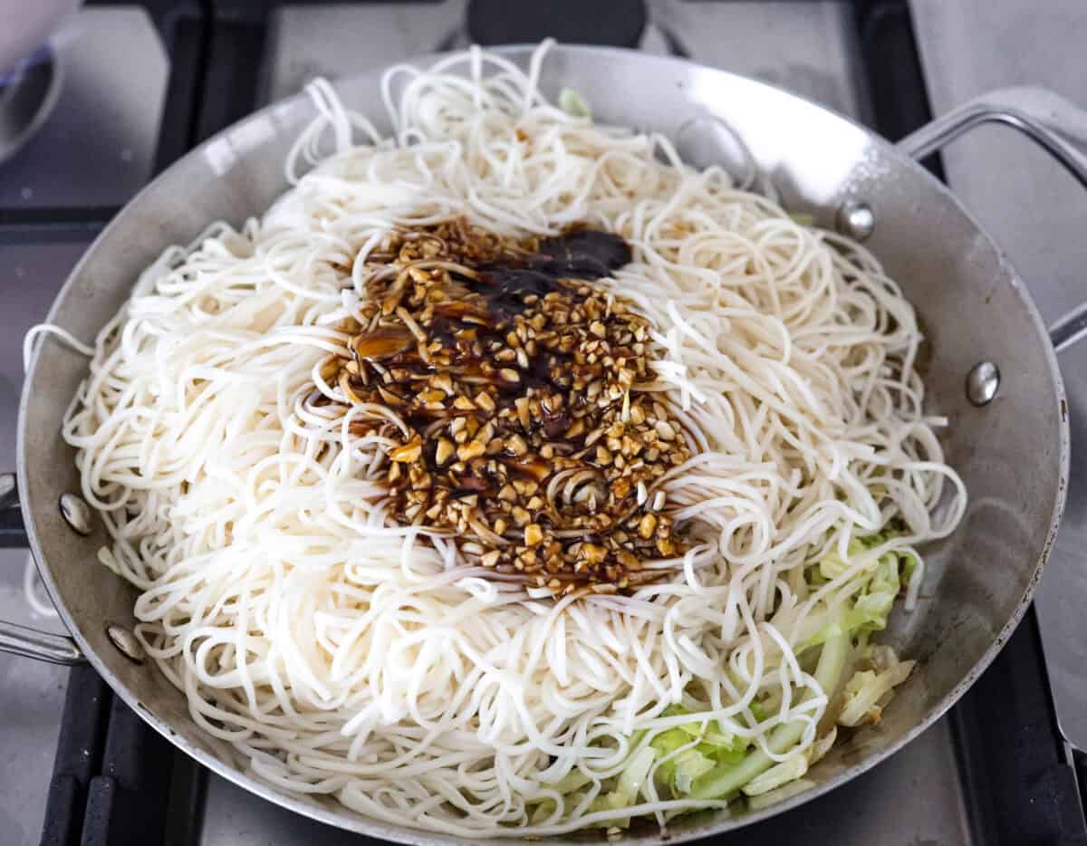 Overhead shot of low mein noodles, sauce and vegetables all in a skillet. 