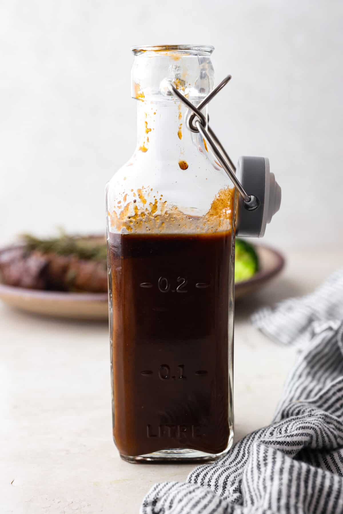 The side photo of the self -made steak sauce in the bottle. 