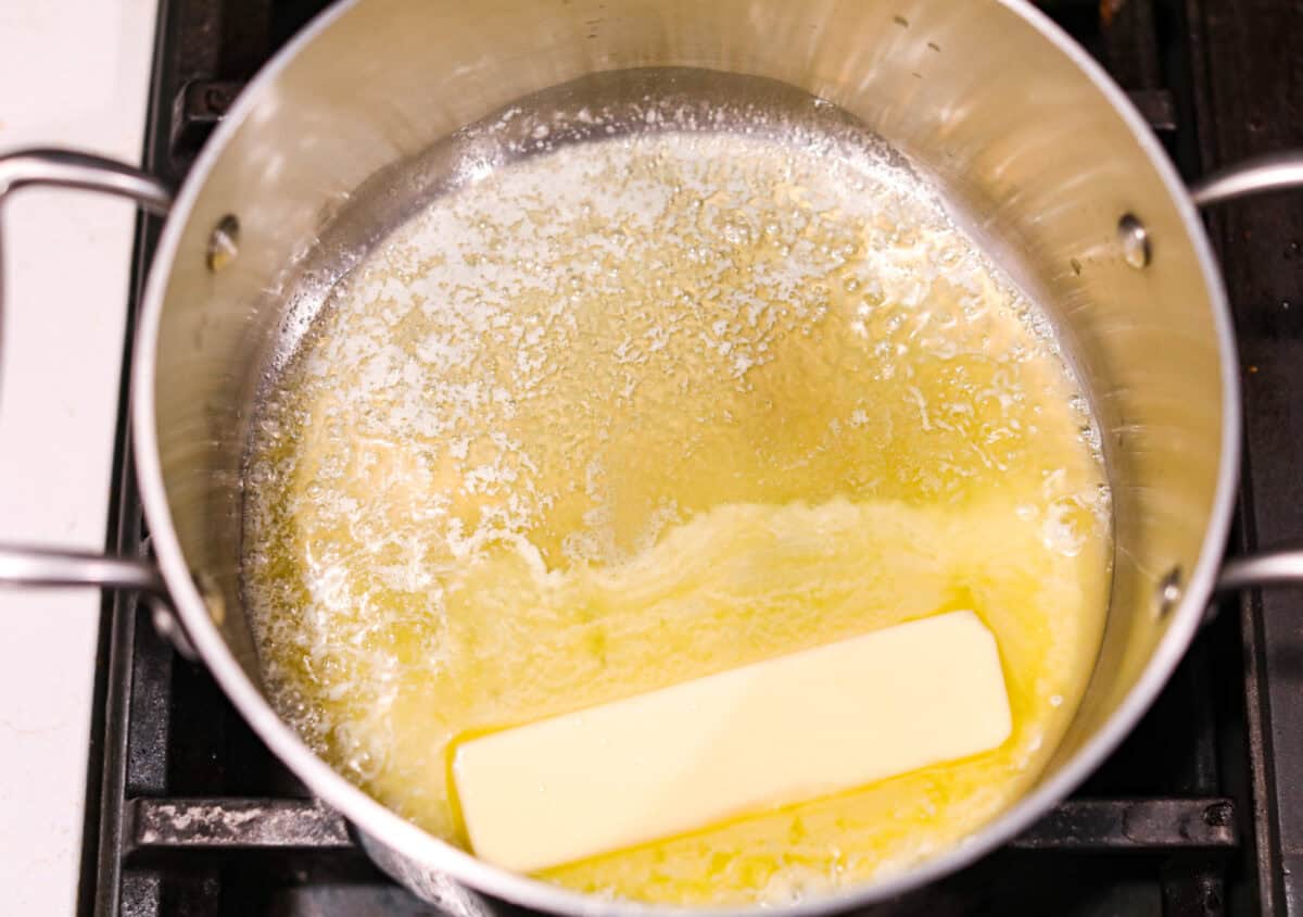 Overhead shot of butter melting in a pot. 