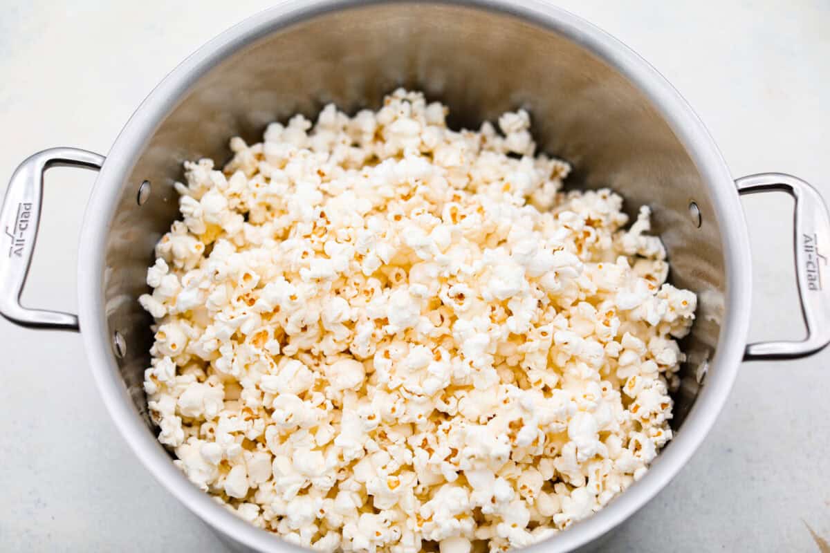 Overhead shot of popped popcorn in a large pot.