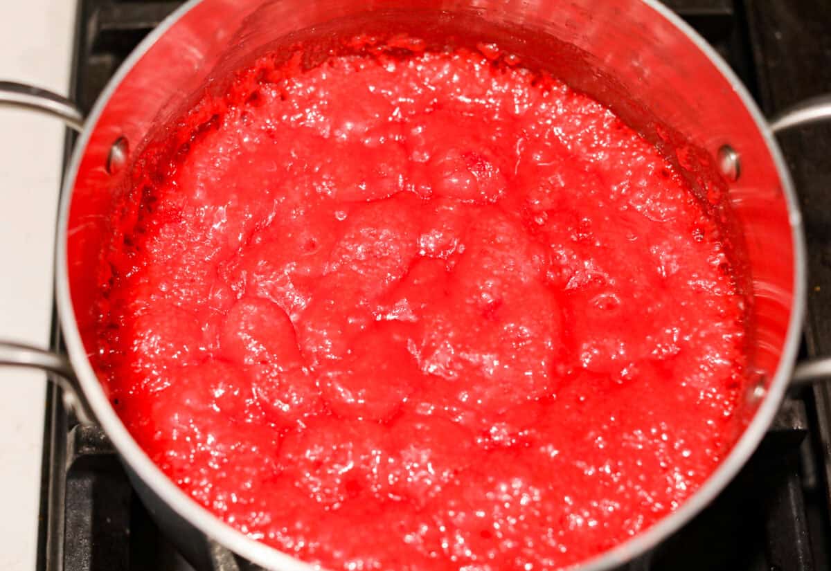 Overhead shot of candy and butter mixture simmering in a pot. 