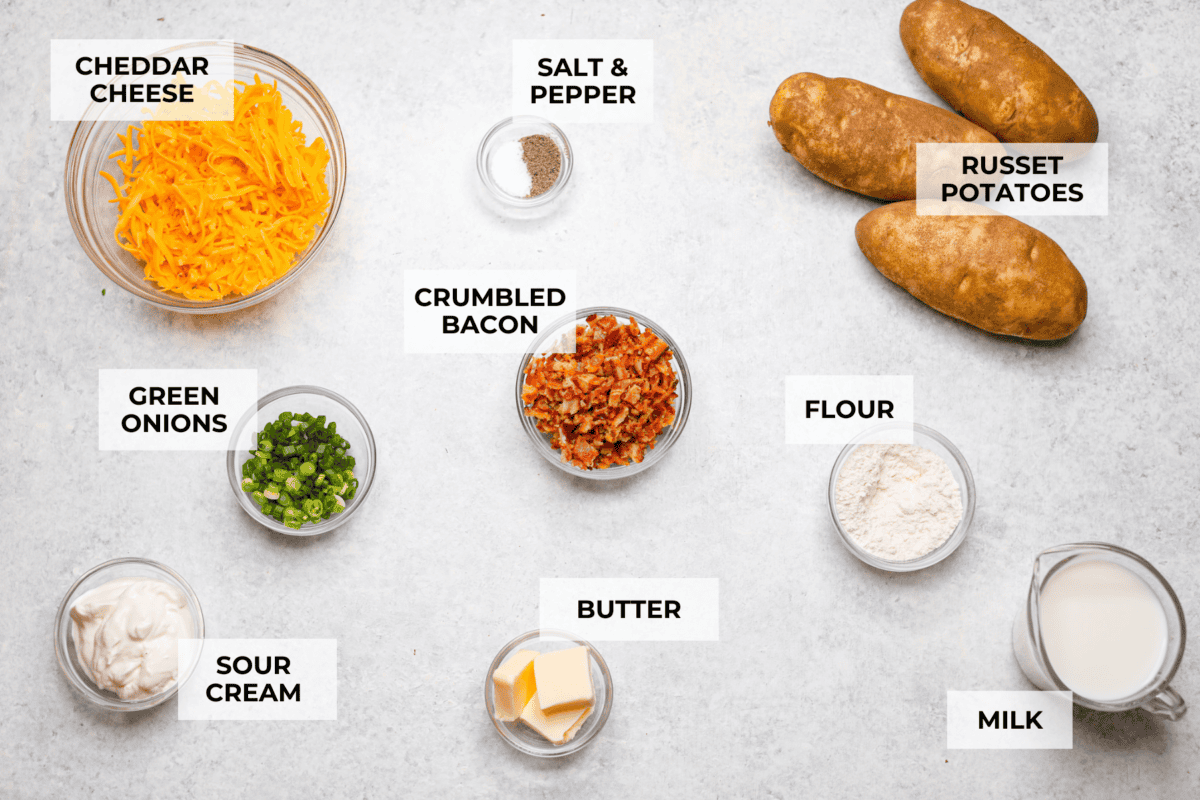 Overhead shot of labeled loaded scalloped potatoes ingredients. 