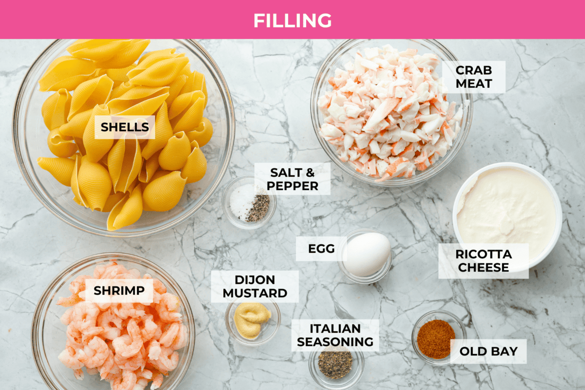 Overhead shot of labeled seasfood stuffed shells filling ingredients. 