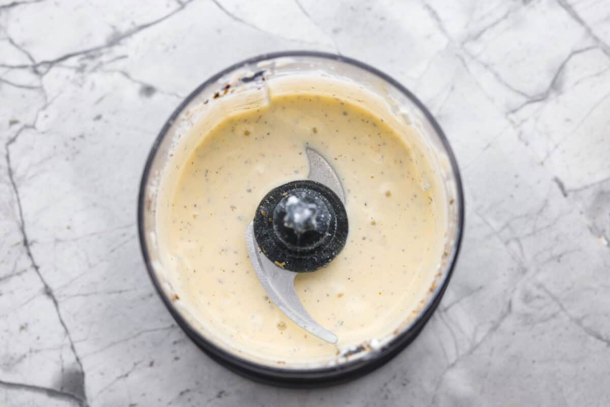 Overhead shot of the food processor with the ingredients blended together.