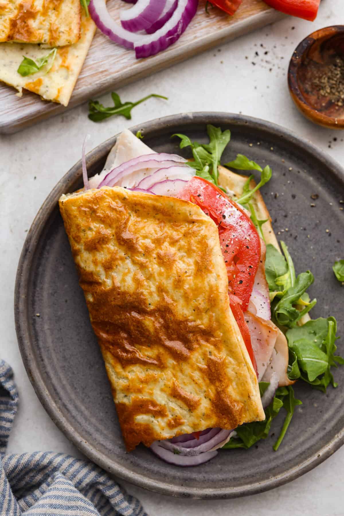 Overhead shot of a sandwich made with cottage cheese flatbread.