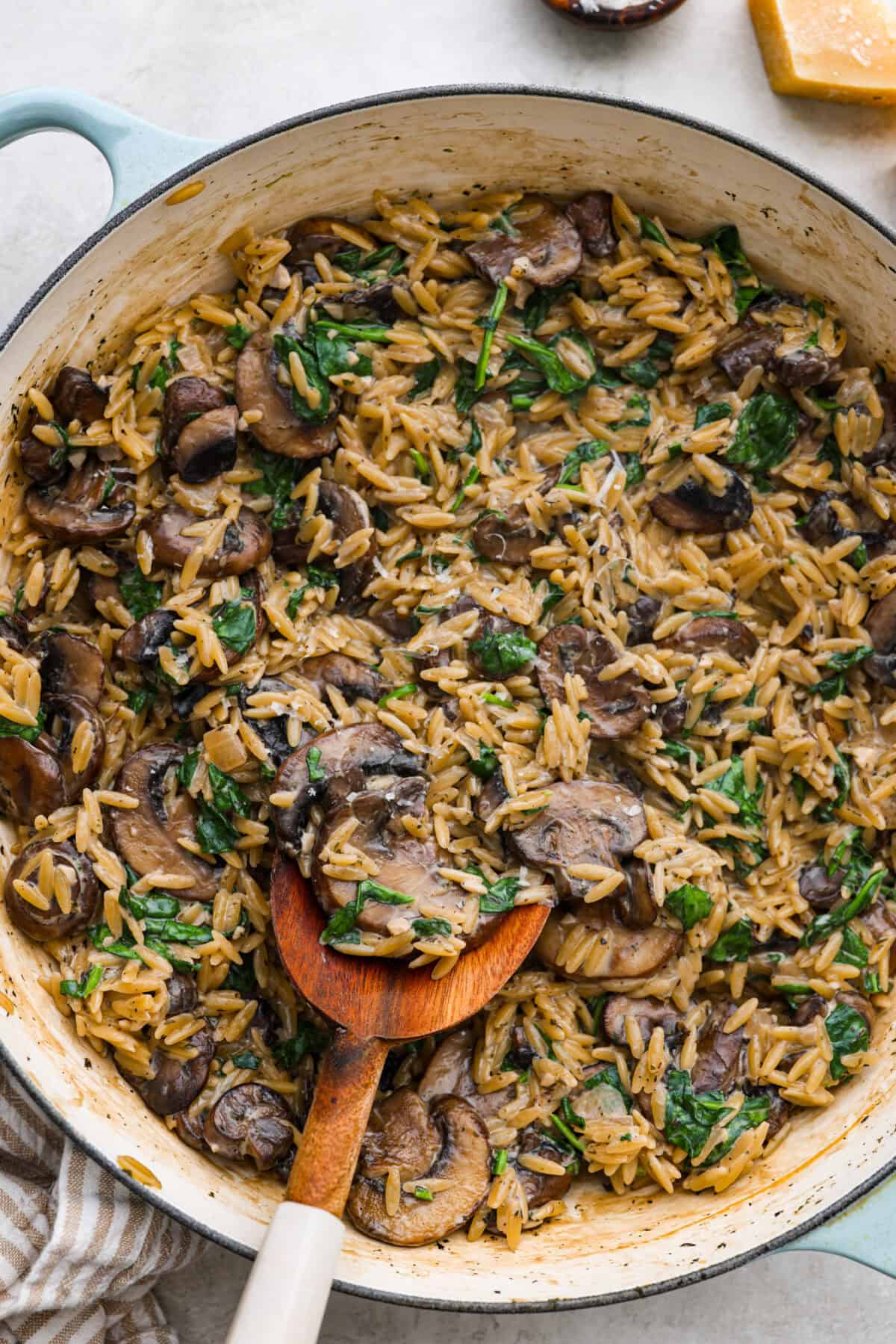 Overhead shot of mushroom orzo in a skillet. 