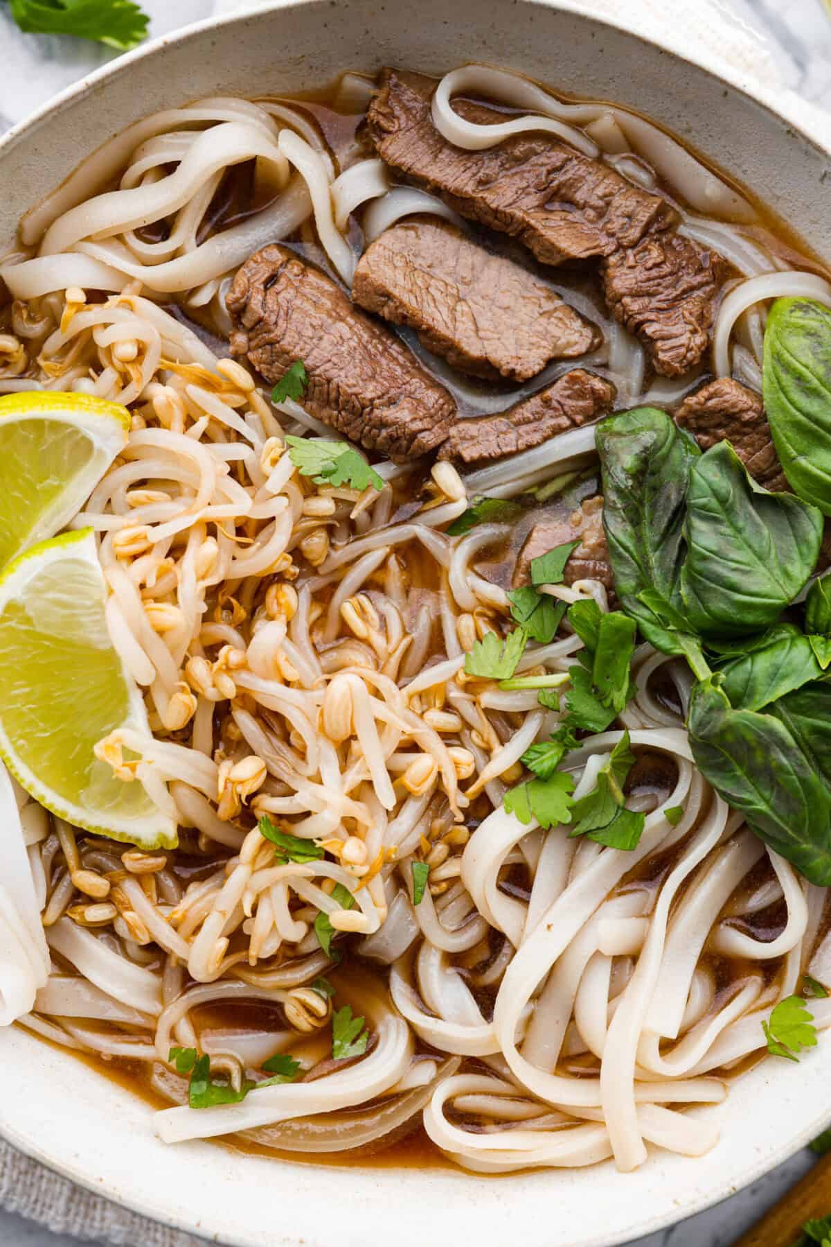 Close up shot of Vietnamese noodle soup in a bowl. 