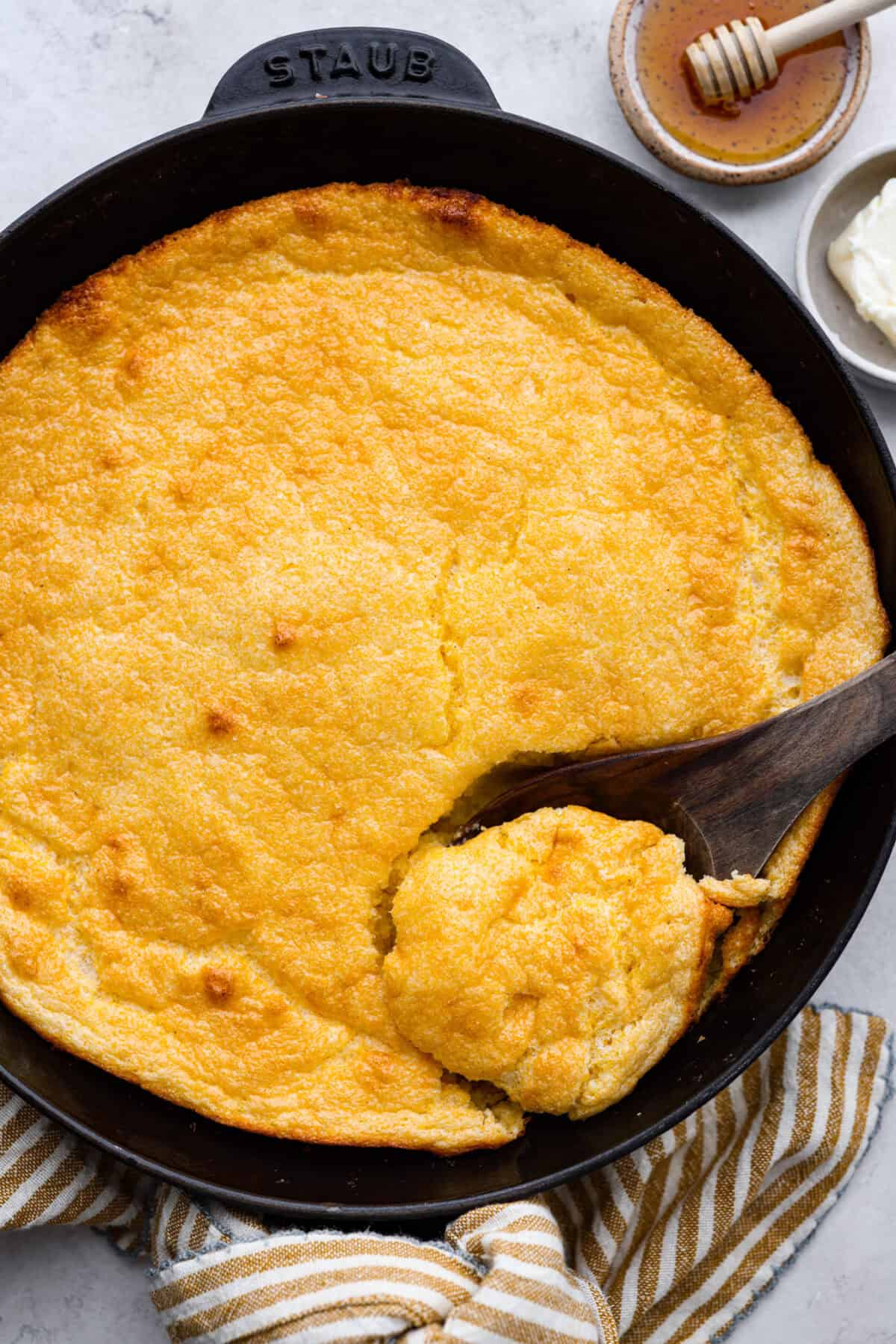 Overhead shot of spoon bread in a skillet.