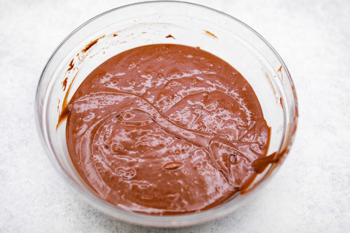Chocolate Mayonnaise Cake is a rich, moist, and decadent dessert that’s super easy to make! The mayonnaise adds extra moisture and creates a soft, tender crumb. Whether for a special occasion or just because it's sure to impress! Overhead shot of the mayo mixture combined with the flour mixture.